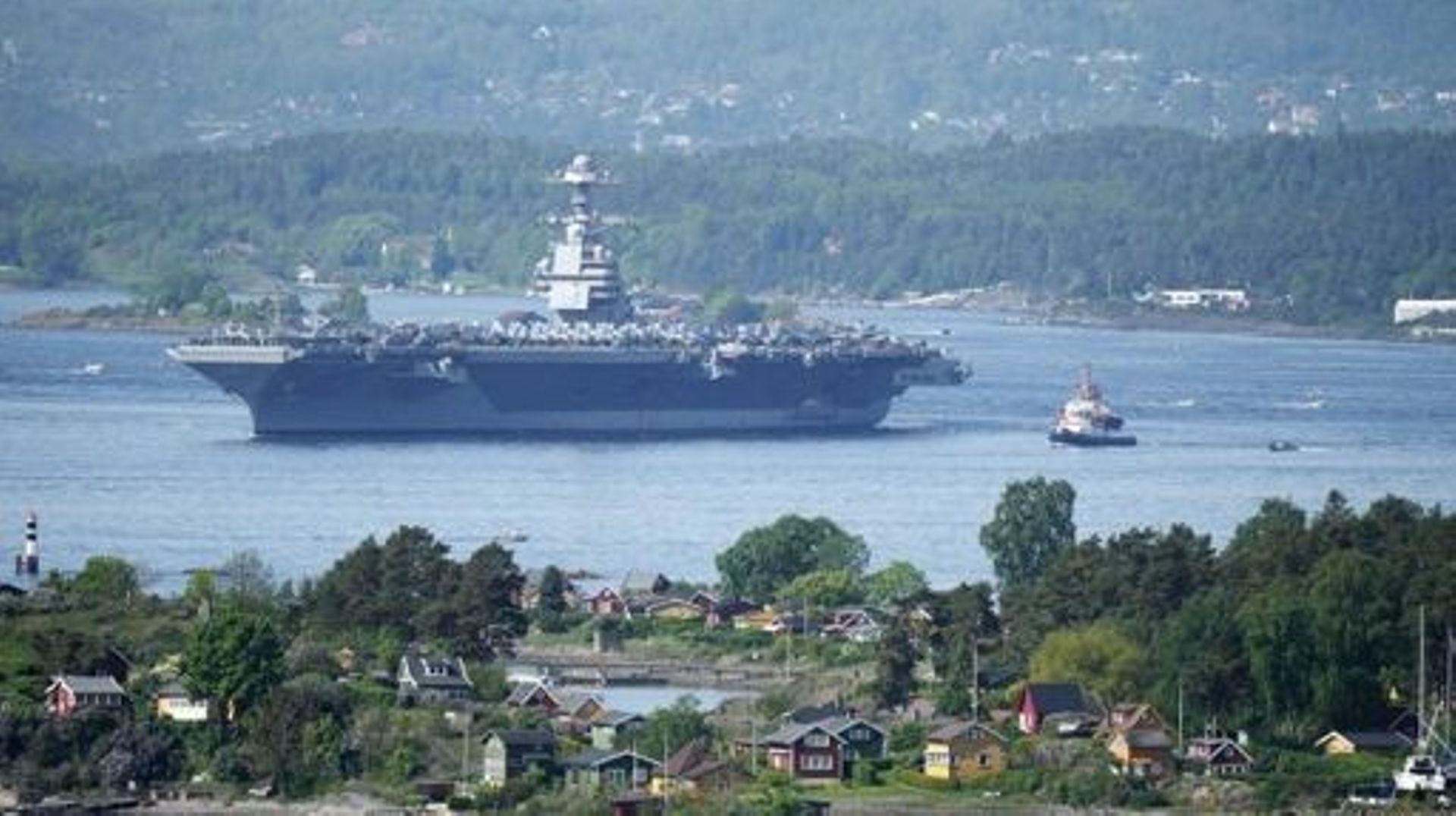 The 337-metre (1,106-foot) USS Gerald R. Ford aircraft carrier of the US Navy is seen in the Oslo Fjord, here seen from Ekebergskrenten in Oslo, Norway, on May 24, 2023. The ship is the world's largest warship and will be in port in Oslo for four days. Ru