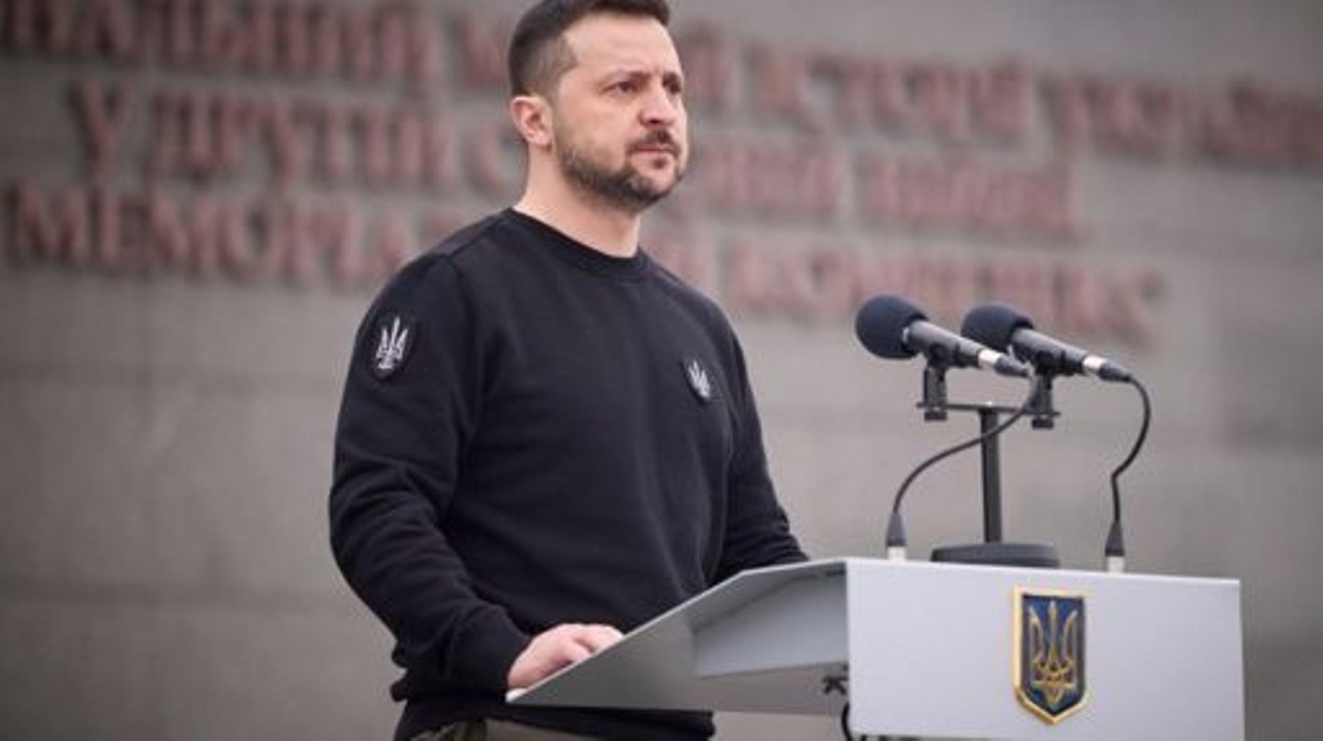 This handout photograph taken and released by Ukrainian Presidential press-service on March 24, 2023, shows the President Volodymyr Zelensky addressing a speech during a ceremony of the 9th anniversary of the National Guard of Ukraine and the graduation o