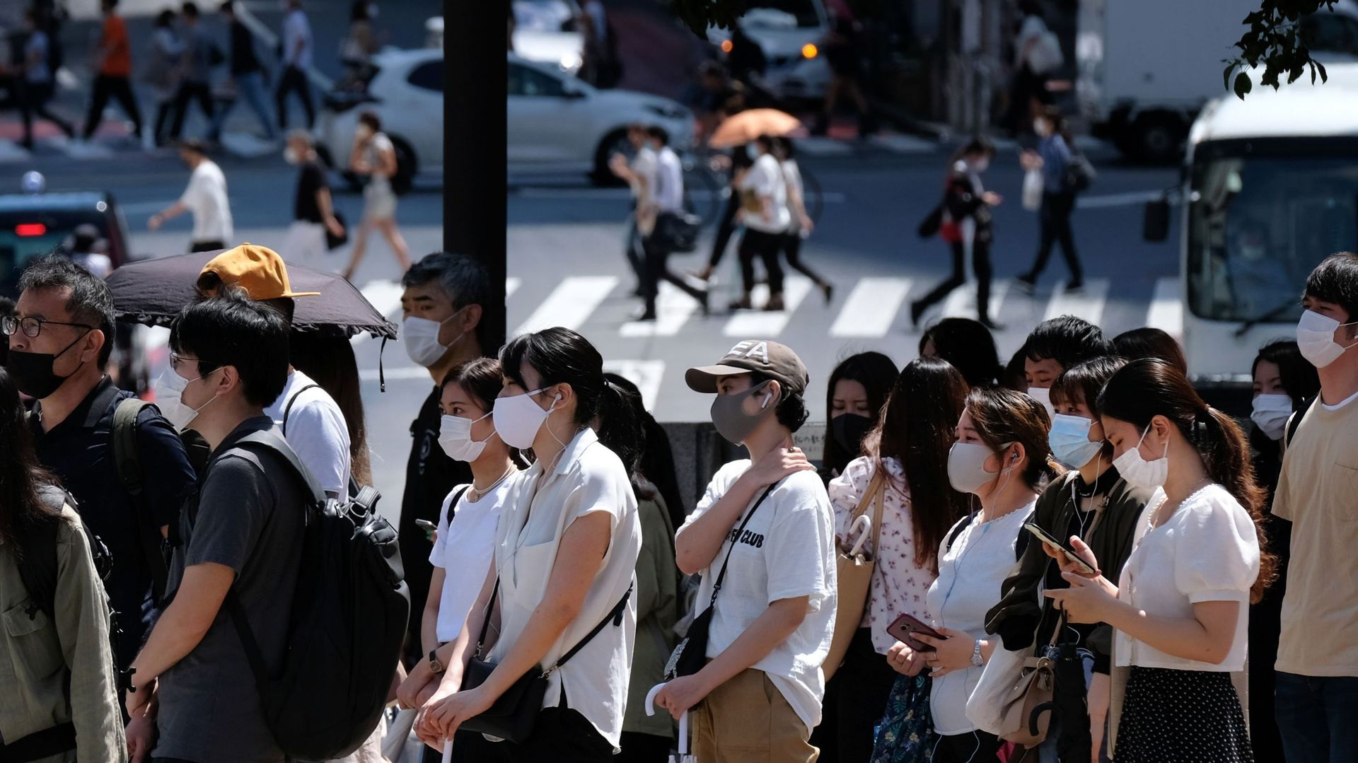 Personnes masquées dans les rues de Tokyo, le 26 juillet 2020