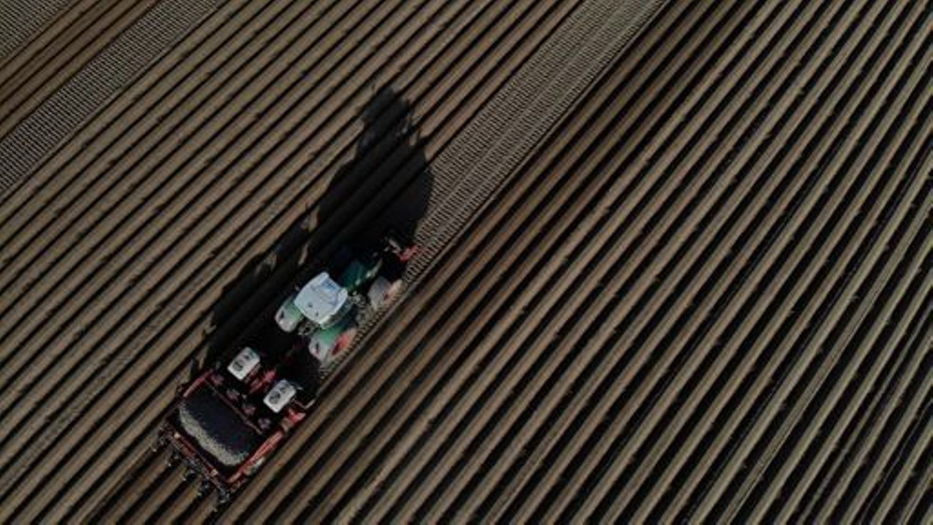 Aerial drone illustration shows  the planting of potatoes in a field in Jauche, Thursday 22 April 2021. BELGA PHOTO ERIC LALMAND