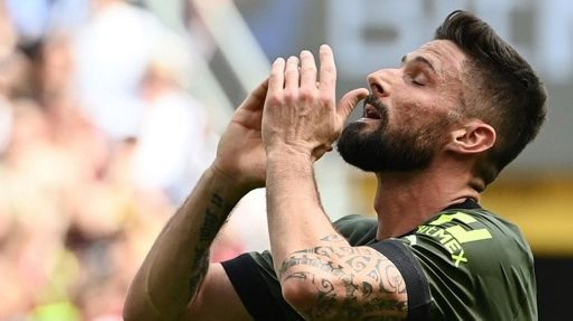 AC Milan’s French forward Olivier Giroud reacts after missing a goal opportunity during the Italian Serie A football match between AC Milan and Lazio on May 6, 2023 at the San Siro stadium in Milan. Isabella BONOTTO / AFP