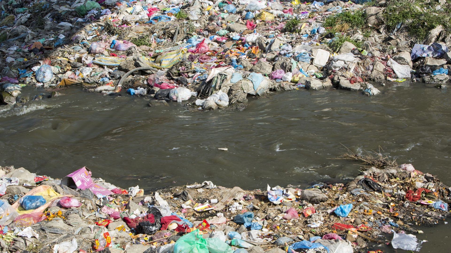 The Bagmati river running through Kathmandu in Nepal. The river is full of litter and raw sewage