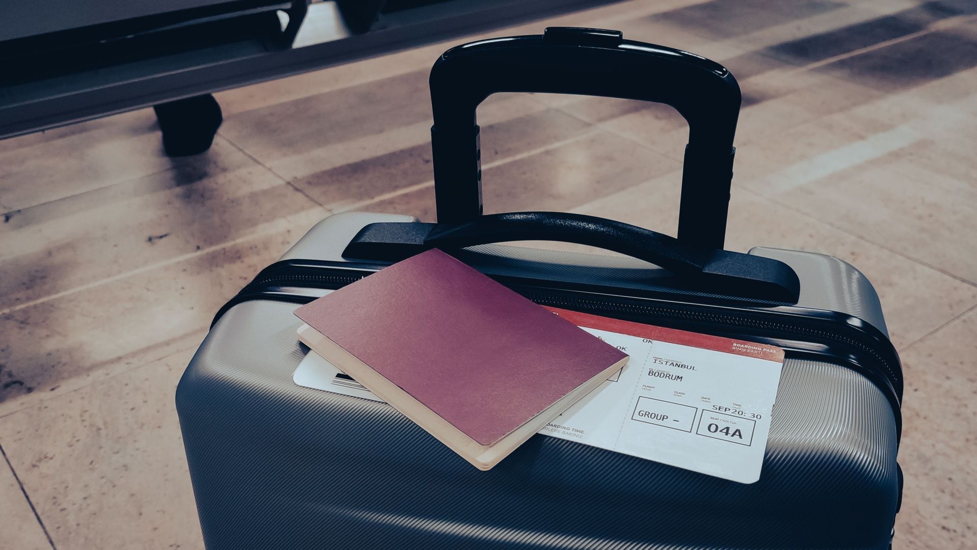 Suitcase, passport and ticket at the airport