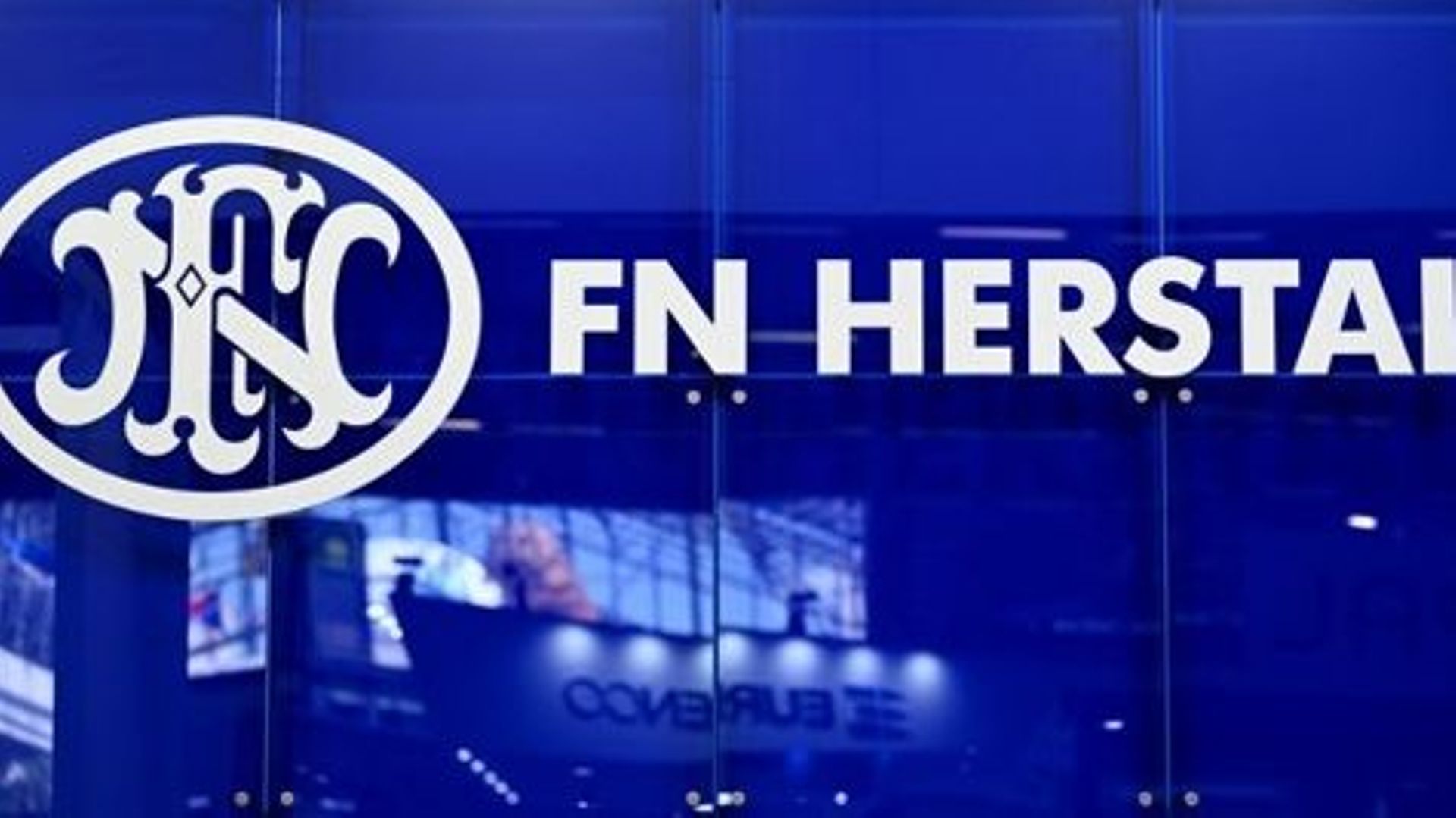 This photograph taken on June 13, 2022, shows the logo from Belgium weapon manufacturer FN Herstal on display at the Eurosatory international land and airland defence and security trade fair, in Villepinte, a northern suburb of Paris.  EMMANUEL DUNAND / A