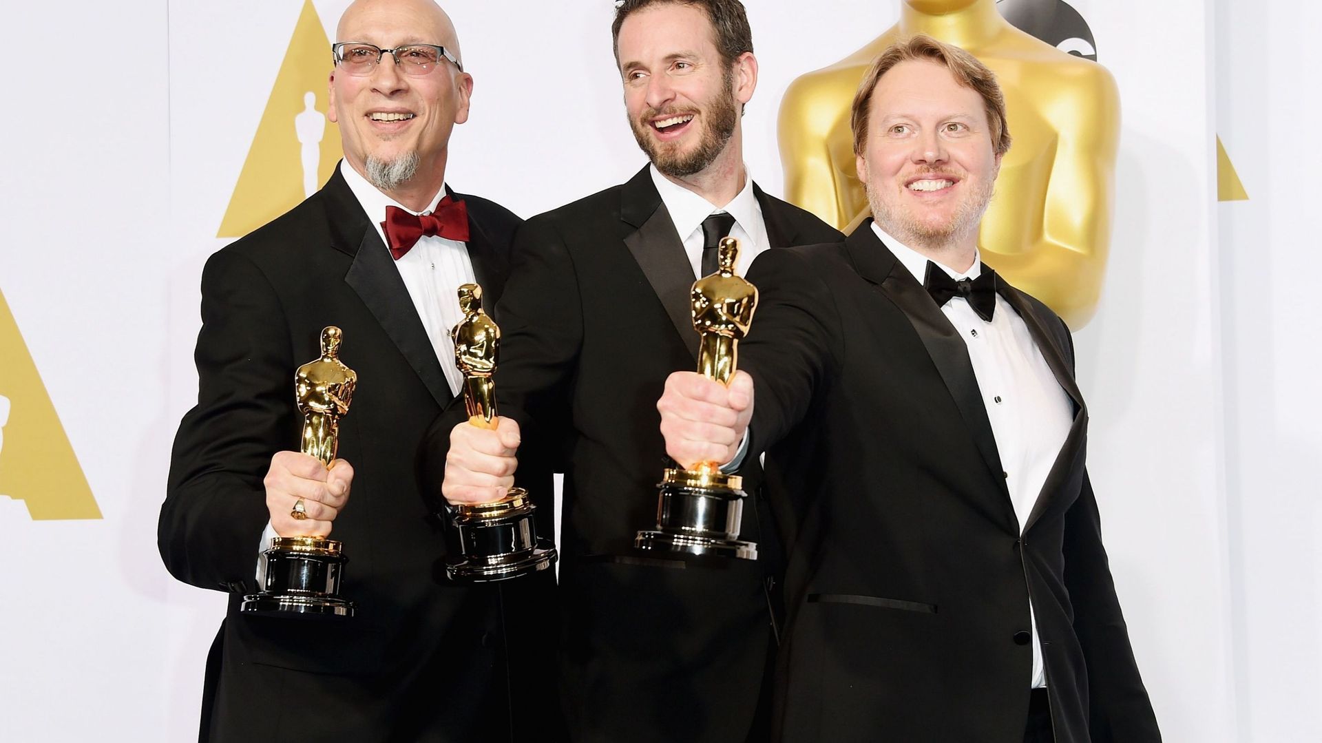 Chris Williams, Roy Conli, et Don Hall ont été récompensés pour le film "Les Nouveaux héros"