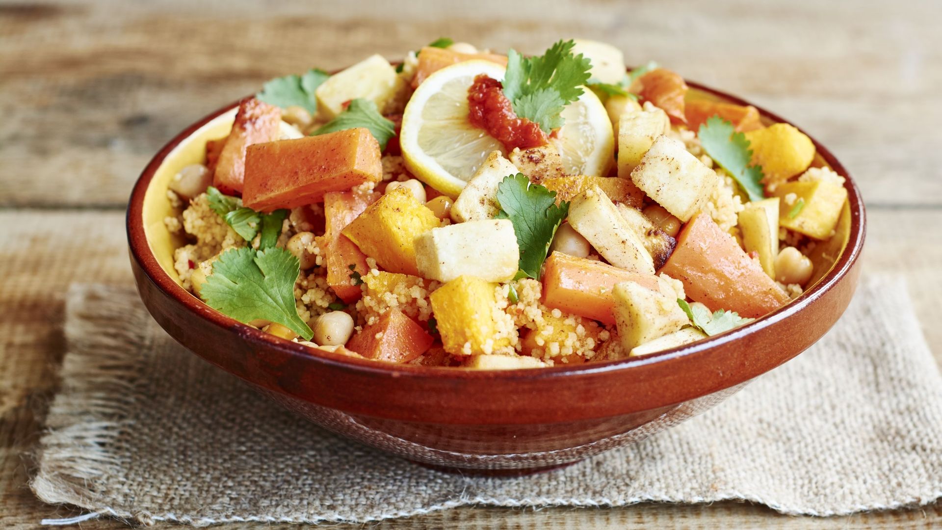 Couscous with vegetables, including carrots, parsnips, pumpkin, shallots, apricots and chickpeas