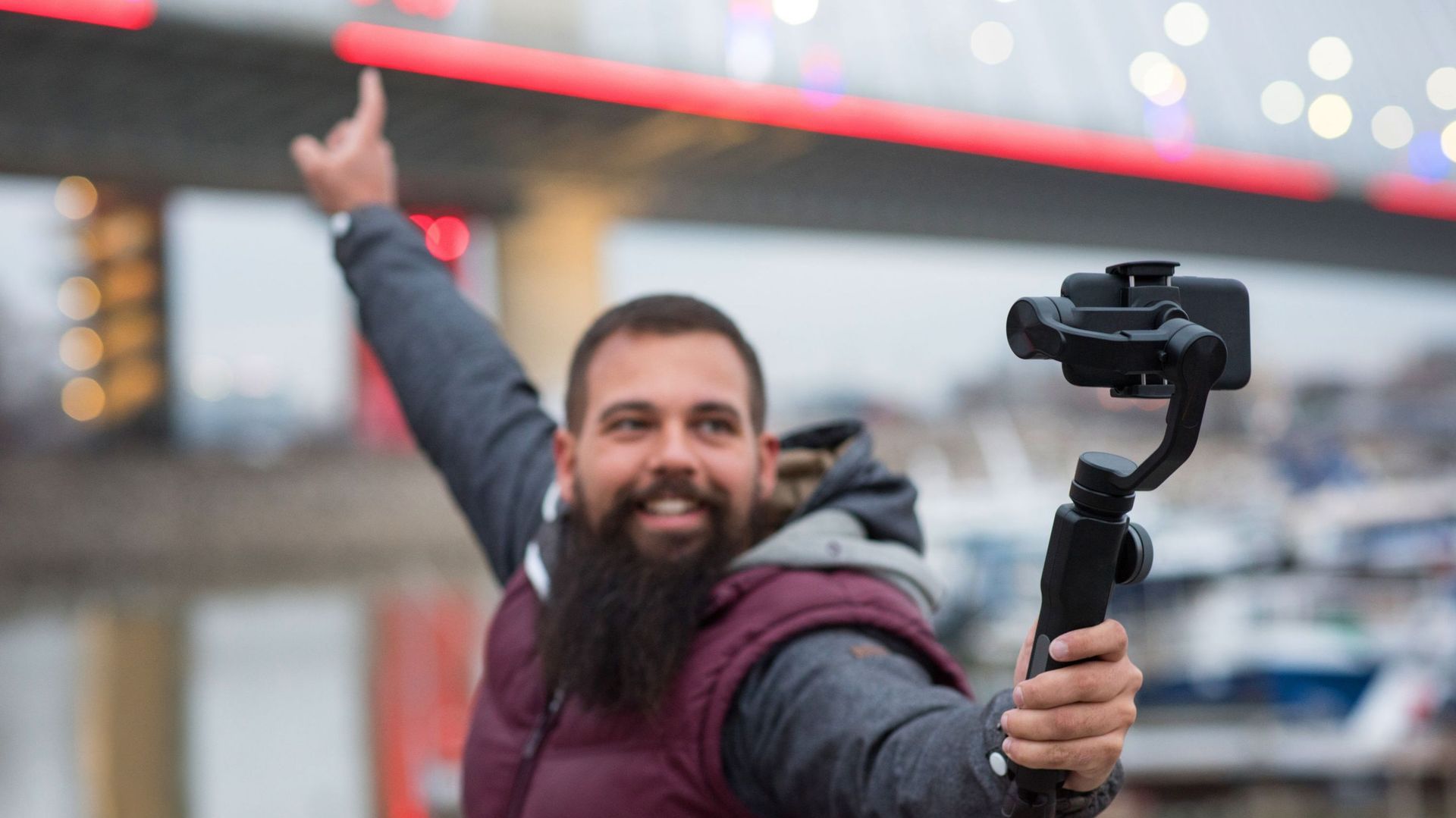 Man taking selfie with camera on the gimbal.