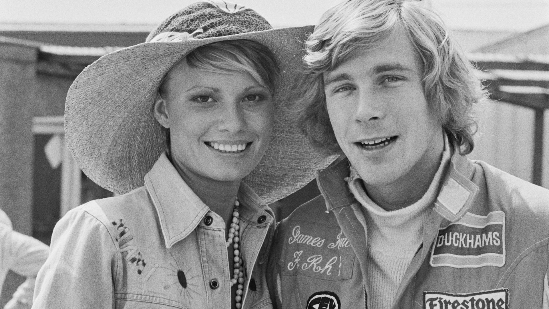 British racing driver James Hunt (1947 - 1993) with his fiancée, fashion model Suzy Miller during the 1974 British Grand Prix at Brands Hatch, UK, 20th July 1974.