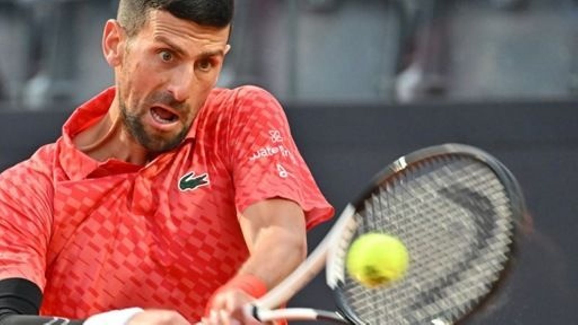 Serbia's Novak Djokovic returns to Argentina's Tomas Etcheverry during their second round match at the Men's ATP Rome Open tennis tournament on May 12, 2023 at Foro Italico in Rome.   Filippo MONTEFORTE / AFP